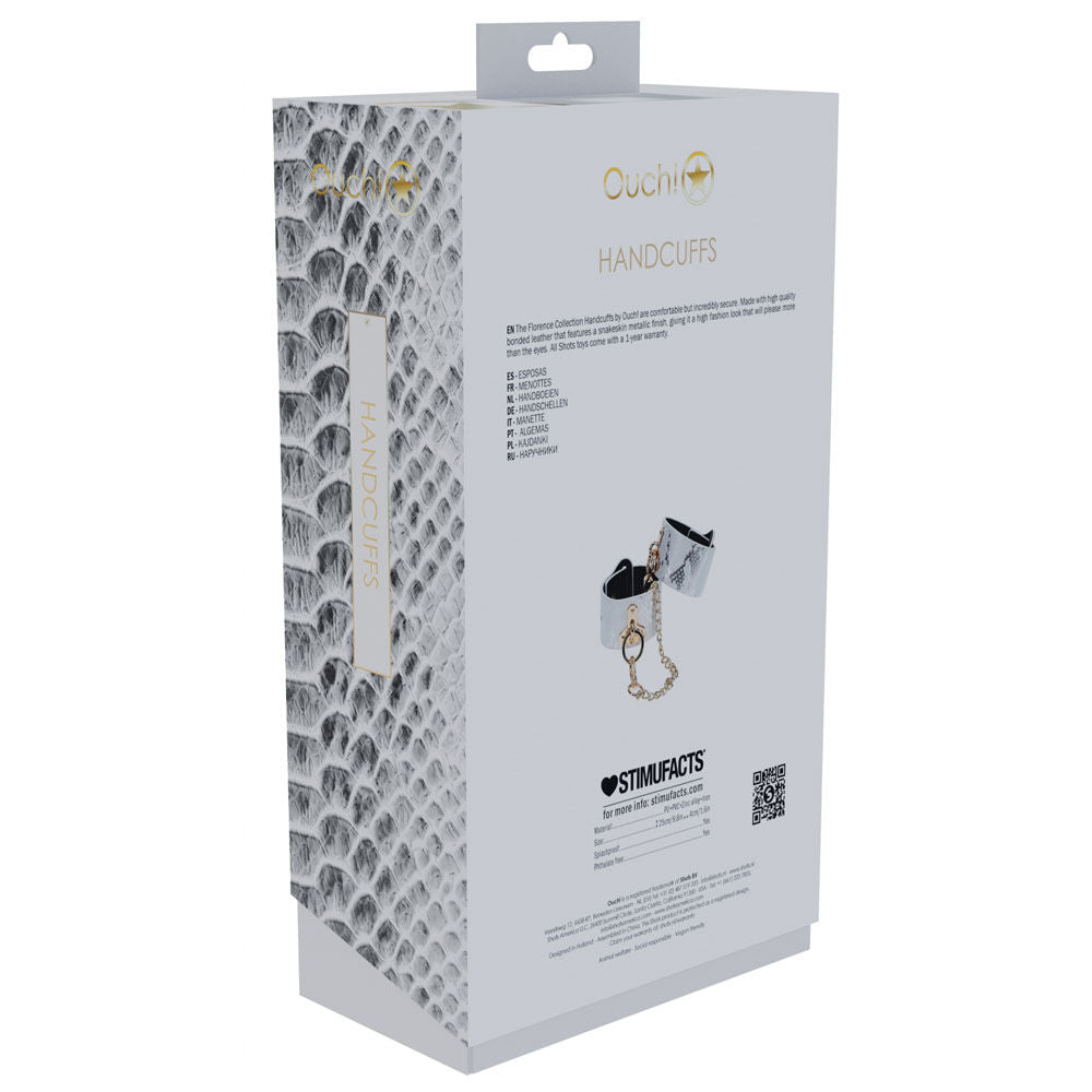 Elegant white faux leather bondage handcuffs with gold chain and snakeskin pattern, perfect for stylish bedroom restraint play, back box view | Flirty Bay online adult store, adult toys and lingerie